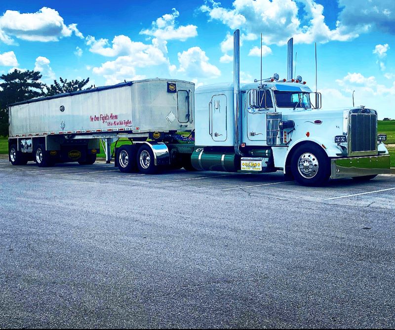 U.S. Bulk end dump tractor trailer in parking lot