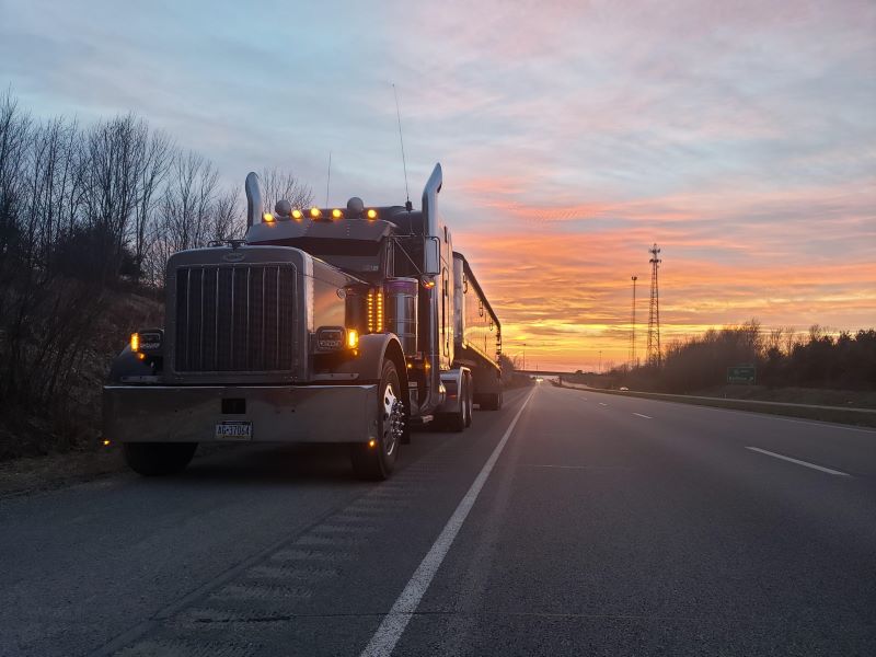 dry bulk end dump trailer driving through southwest